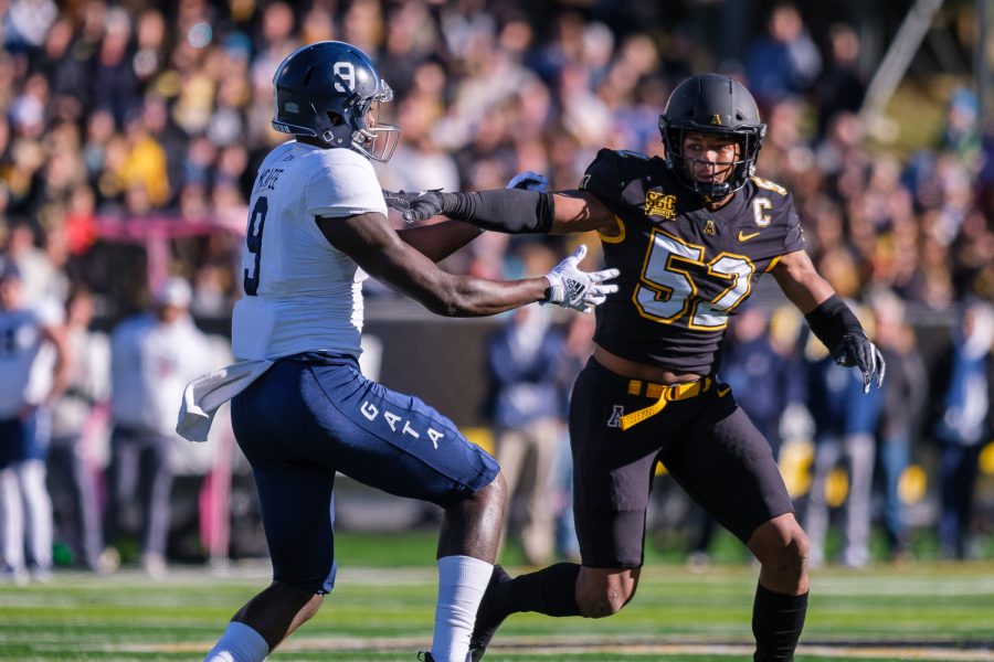 Senior linebacker DMarco Jackson stiff arms a Georgia Southern receiver in a 27-3 Senior Day victory. Jackson finished with seven tackles, including one tackle for loss.