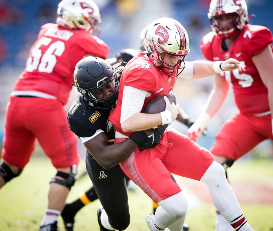 Junior linebacker Nick Hampton sacks Hilltopper quarterback Bailey Zappe to force a fourth-and-23. Hampton was the only Mountaineer to come away with a sack. 