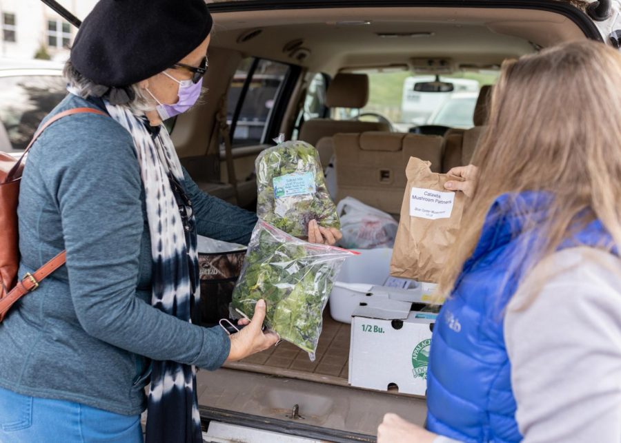 From right, Boone locals and App State alumni Debora Macey and Jill Smith shopping at the food hub on Jan. 19 2022.