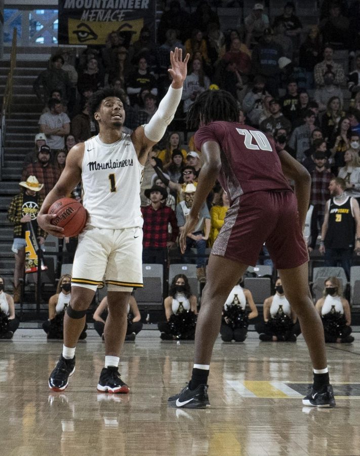 Senior guard Justin Forrest sets up the Mountaineer offense against the Trojans. 