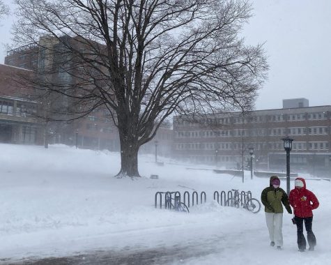 Two students fight the wind on Sanford Mall during the storm Monday, Jan. 17, 2022.