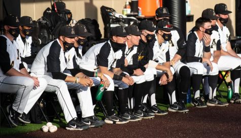 The App State baseball team looks on from the dugout during their game against North Carolina A&T in 2021. 