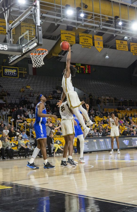 Senior guard Adrian Delph soars for a one-handed jam against Georgia State Feb. 12. 