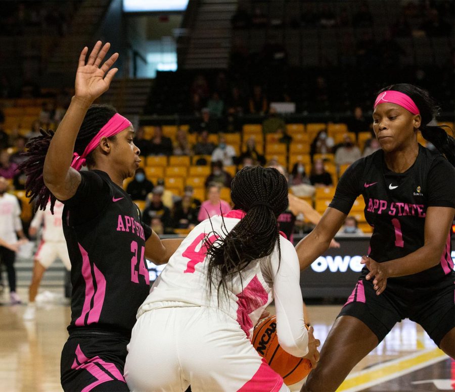 Janay Sanders and Mariah Frazier trap Texas States Sierra Dickson in the frontcourt. 
