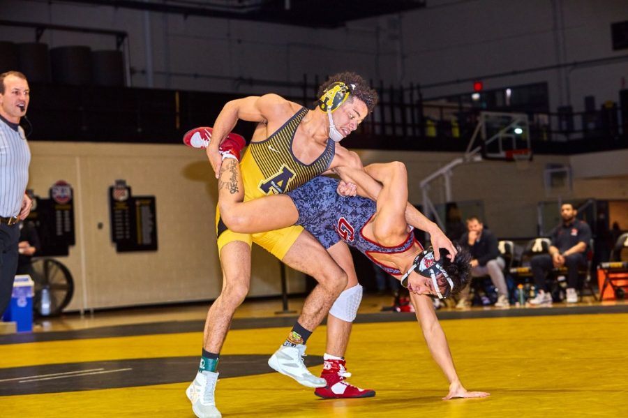 Redshirt sophomore Caleb Smith battles with a Gardner-Webb wrestler on his way to a second round victory. 
