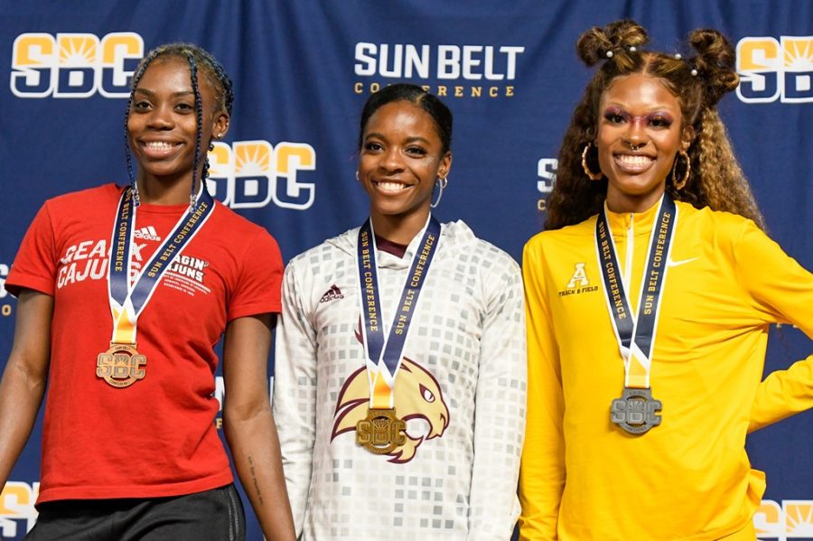 Graduate student Peighton Simmons captures the silver medal in the long jump. 