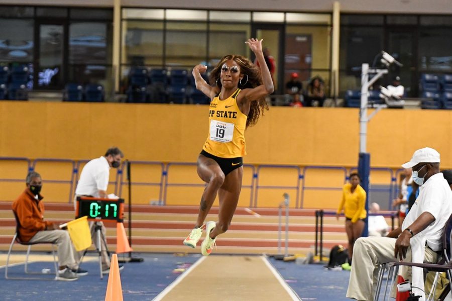 Graduate student Peighton Simmons leaps to a gold medal in the triple jump at the SBC Indoor Championship. 