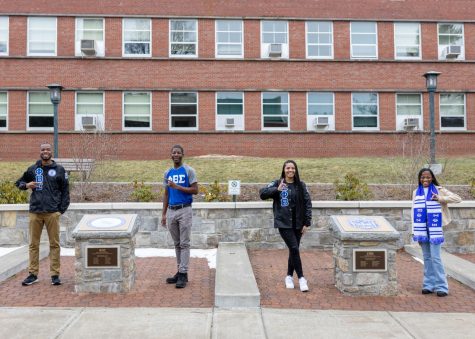 Phi Beta Sigma Fraternity Incorporated members Jaylen Sturdivant and Izaiah Hamilton and Zeta Phi Beta Sorority Incorporated members Kyra Scott and Nadia Jenkins (left to right) stand next to their organizations plots located outside I.G. Greer Monday, Feb. 7, 2022.