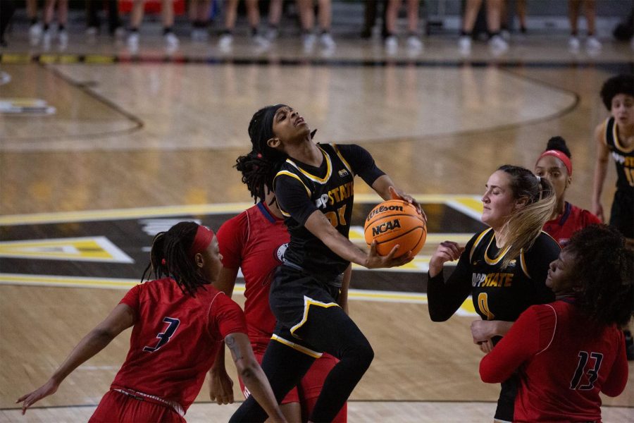 Junior guard Janay Sanders absorbs contact as she powers her way to the basket against South Alabama Feb. 26, 2022. 