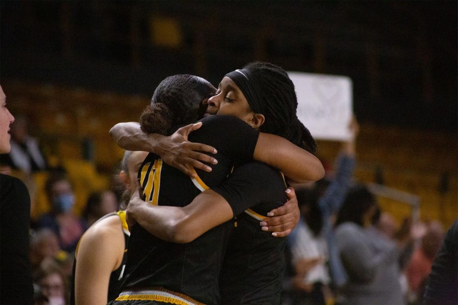 Junior guard Janay Sanders embraces senior forward Michaela Porter after capturing a 72-50 Senior Day victory in the Holmes Center Feb. 26, 2022. 
