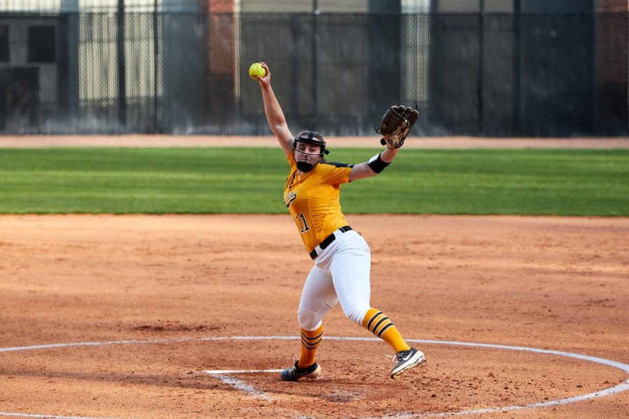 Sophomore+pitcher+Delani+Buckner+unloads+a+pitch+from+the+mound+against+UNCG+Feb.+20%2C+2021.