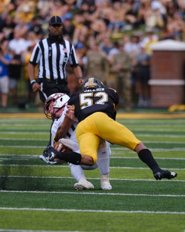 Senior linebacker DMarco Jackson wraps up the ULM quarterback in a 59-28 victory Oct. 30, 2021. 