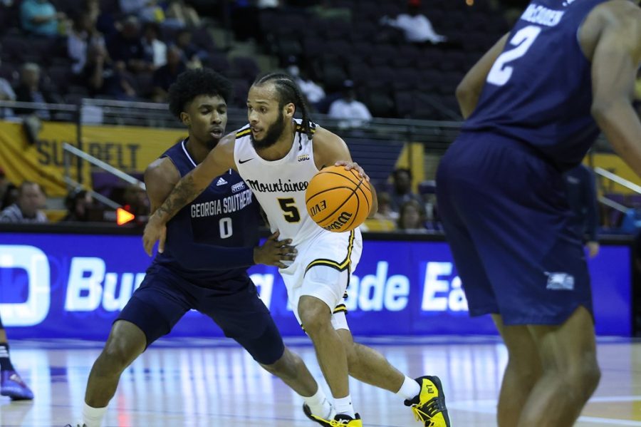 Graduate guard Michael Almonacy drives past a Georgia Southern defender in App State's 13-point quarterfinals victory March 5, 2022. 