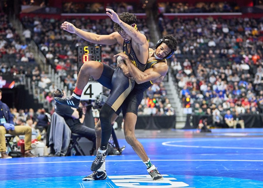Redshirt senior Jonathan Millner slams eighth-seeded Max Murin of Iowa in his 8-1 decision March 18, 2022. 