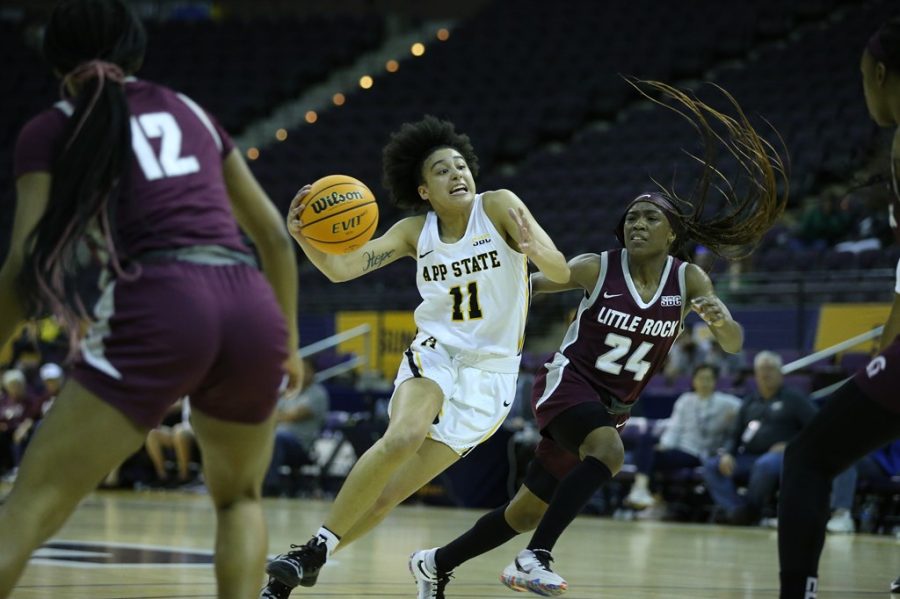 Sophomore guard Faith Alston drives past a Little Rock defender in her 24-point performance March 4, 2022. 