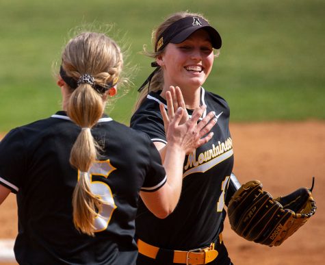 No. 5 Addie Wray high fives teammate Kayt Houston during App States 3-0 victory over Western Carolina Feb. 25, 2022. 
