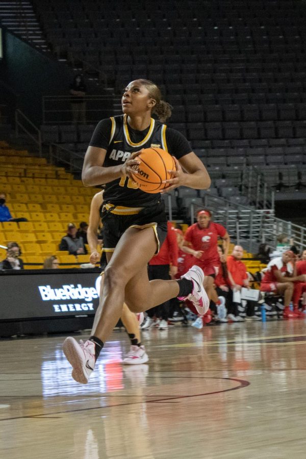 Senior forward Michaela Porter dribbles the ball down the court during the last home game of the season against South Alabama Feb. 26, 2022. 