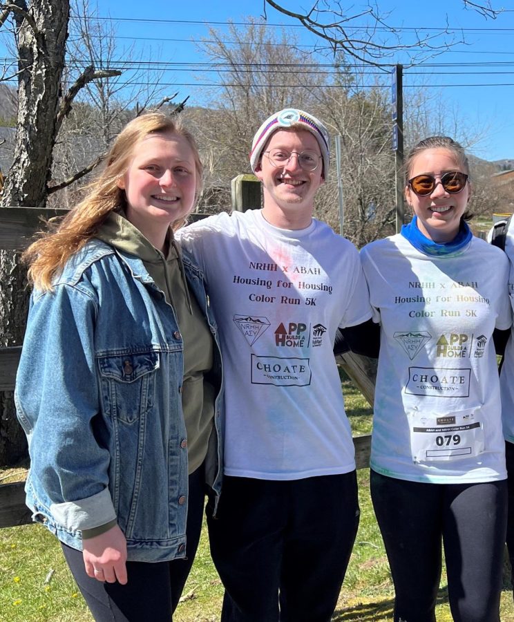 Anna Thomson, NRHH president, Austin Balent, upcoming president, and Mackenzie Millett, student director for ABAH, pose next to the bridge that connects the Greenway Trail and Leon Levine Hall April 10, 2022. 
