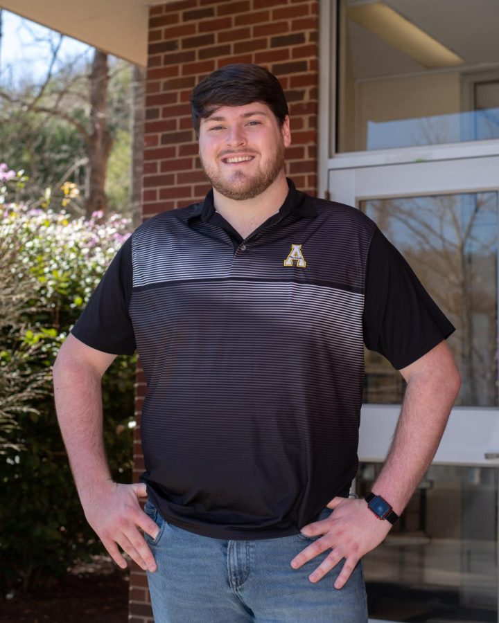 Resident director and graduate student, Dalton Stroup poses for a portrait in front of Bowie Hall Monday, March 28 2022.