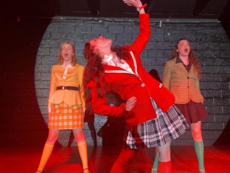 Kayla Miller, left; Kathleen Kennerly; and Lyndsay Snider, right, rehearse for “Heathers: The Musical” in Legends March 27, 2022.