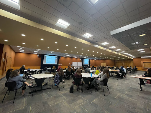 Attendees watch the workshop, April 8, 2022. 