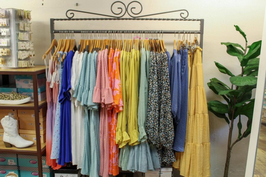 A rack of vibrant clothes sits in Boone Belles April 13, 2022. 