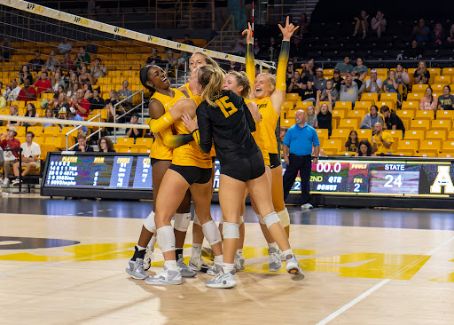 App State volleyball celebrates its set-winning point against ETSU to put them up 2-0 in their August 18, 2022, exhibition match.