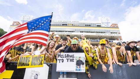Frontline fans in the student section cheer and yell in excitement for the kickoff of the 2022 season. Students were camped out as early as 6 a.m. for the in-state matchup.