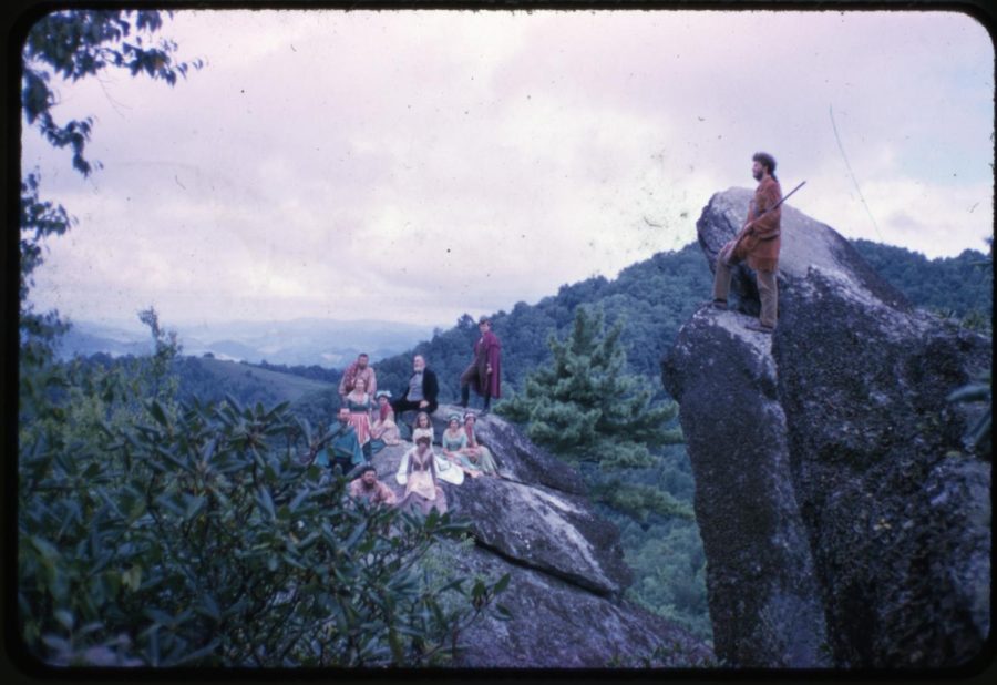 Horn in the West cast on a boulder, with Glenn Causy overlooking the scene on the right hand boulder, circa May 1960. Photograph by George Flowers. Photo courtesy of Digital Watauga. 
