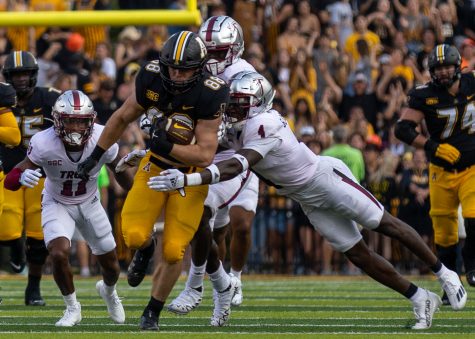 Senior tight end Henry Pearson sheds a Trojan tackler in App States 32-28 victory over Troy Sept. 17, 2022. 