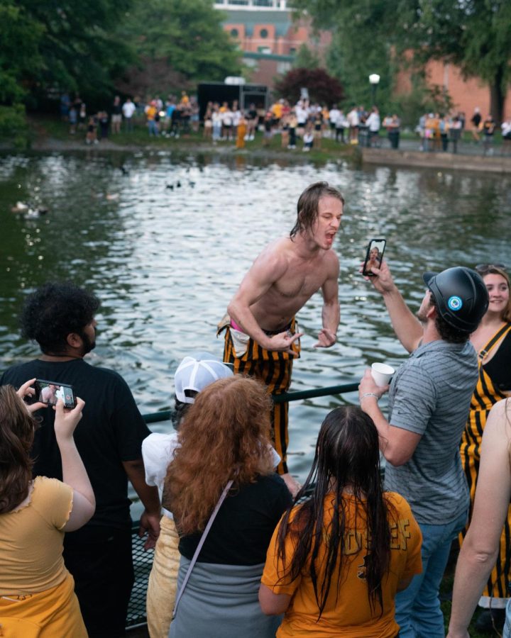 App State fans dive headfirst into the duck pond in celebration of their win over Troy.