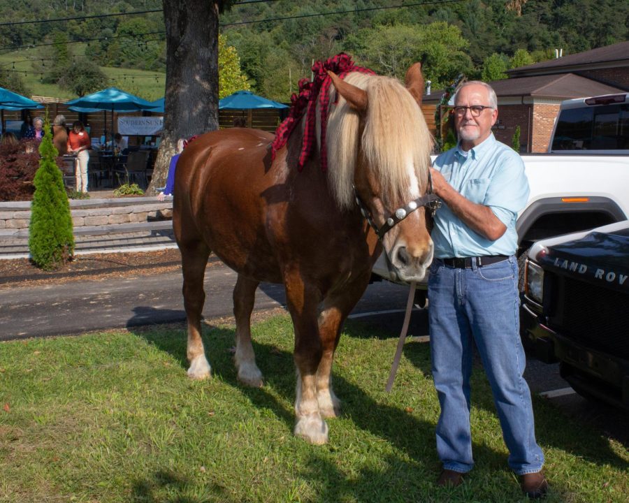 Tony Graham stands with a rehabilitated draft horse named Doc, Sept. 15, 2022.