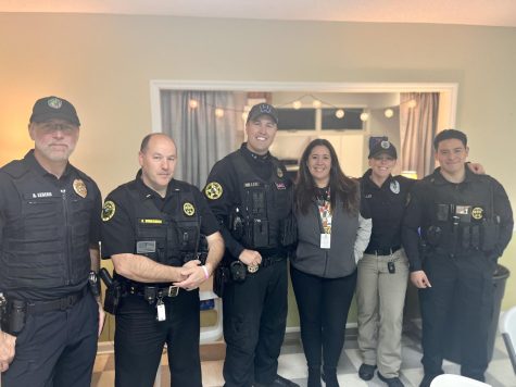Pictured left to right are Chief of Police Andy Le Beau, Lieutenant Brian Bumgarner, Sergeant Casey Miller, Yolanda Adams, Officer Kat Eller, and Officer Derrick Zamora who pose for a picture, Oct. 25, 2022.