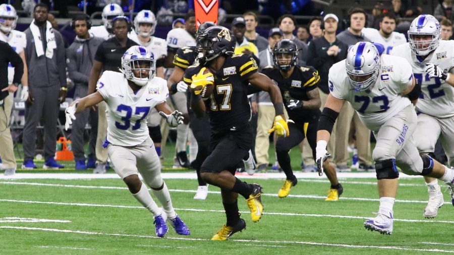 Former App State cornerback Tae Hayes dodges defenders during an interception return in the New Orleans Bowl victory over Middle Tennessee Dec. 15, 2018. Hayes was signed to the 53-man roster by the Carolina Panthers Oct. 25, 2022.