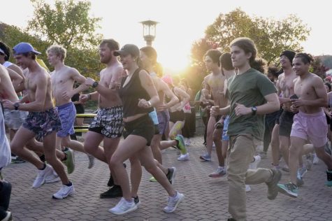 Runners take off at the start of the annual Neerly Naked Mile event on Sanford Mall, Oct. 24, 2022. The event raises money and spreads awareness about Boone’s homeless population.