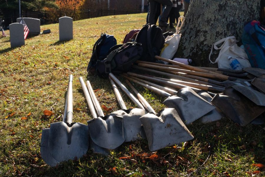 Shovels lie in the early morning sun next to volunteers backpacks in the cemetery. The event started at 9 a.m. and went until about 10:30 a.m.