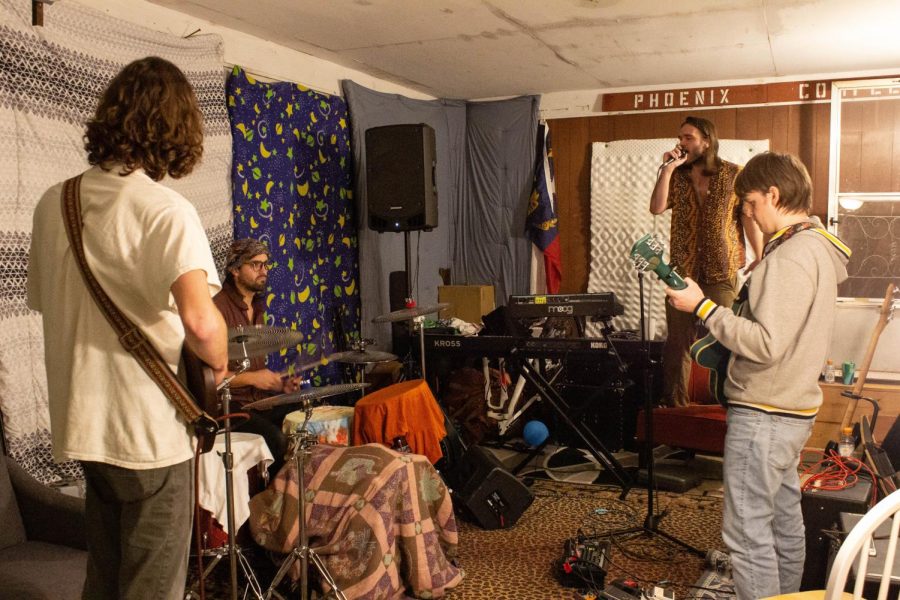 The Coyotes practice at the home of band member Noah Schoenacher before a show Oct. 31, 2022. (From left to right: Jacob Hastings, Noah Schoenacher, Edwin Thomas Jr., and Joseph Heiston.)
