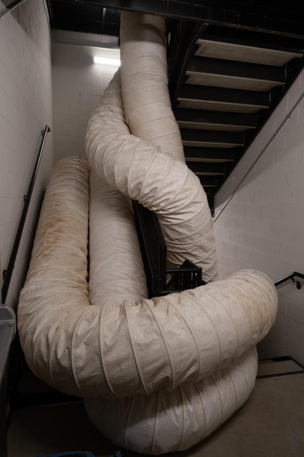 Pipes are used to pump hot air into the building, snaking their way up the stairwell to go to each floor.
