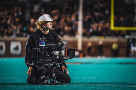 Junior electronic media/broadcasting major Will Allen with his camera at App State footballs game versus Coastal Carolina Nov. 3, 2022.