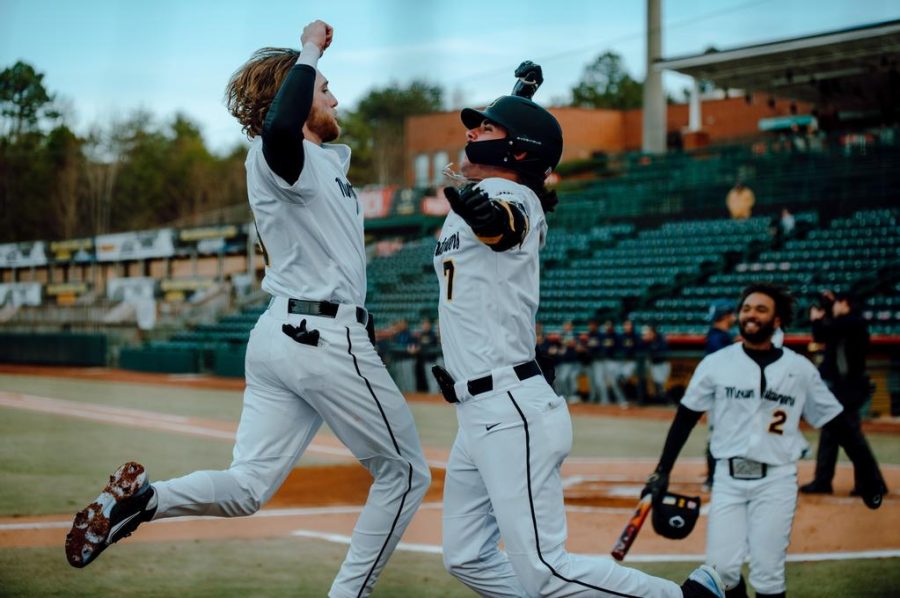 Senior utility player Andrew Terrell and redshirt sophomore infielder Austin St. Laurent celebrate during App States 5-2 victory over Queens Feb. 17, 2023. 