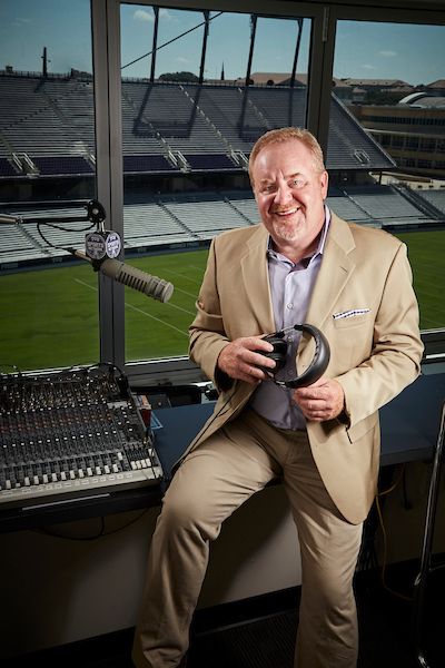 Brian Estridge poses for a portrait in his booth at Amon G. Carter Stadium, the home of the Texas Christian University Horned Frogs.