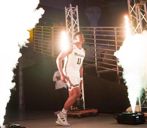Senior forward Donovan Gregory runs out of the tunnel at the start of the game against South Alabama, Feb. 19th, 2022.