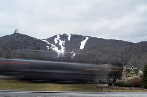 A motion blurred vehicle travels northwest on Tynecastle Highway, passing Sugar Mountain Resort on Feb. 15, 2023. 