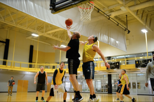 One App State faculty member lays the ball up during noontime basketball March 8, 2023. 