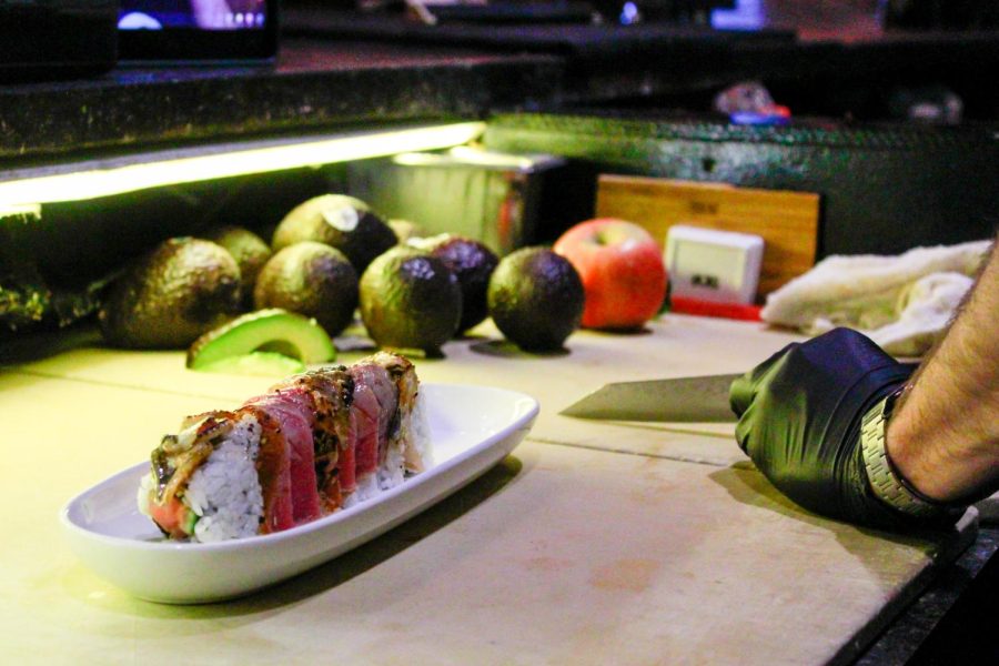 Sushi+Chef+Jesse+Maltby+creates+a+unique+sushi+roll+while+streaming+live+on+CoBo%E2%80%99s+TikTok+account.+CoBo+is+located+at+161+Howard+St.