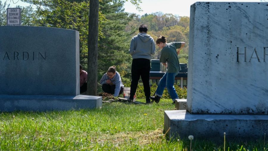 Volunteers work on digging up cemetery grounds for stone fence project. Apr.30, 2023.