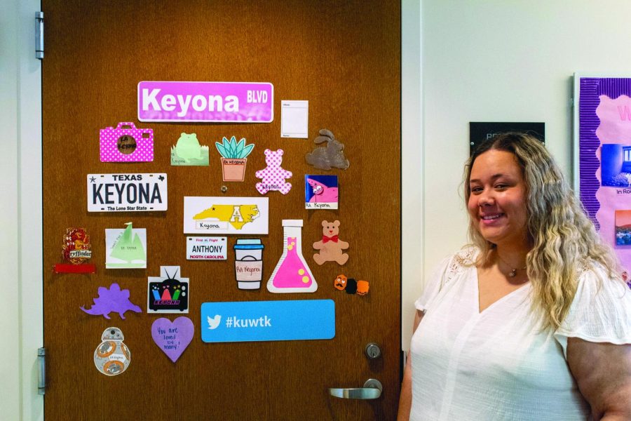 Keyona Anthony, a senior psychology major, and RA for Summit Hall, poses by her dorm room on the 10th floor.