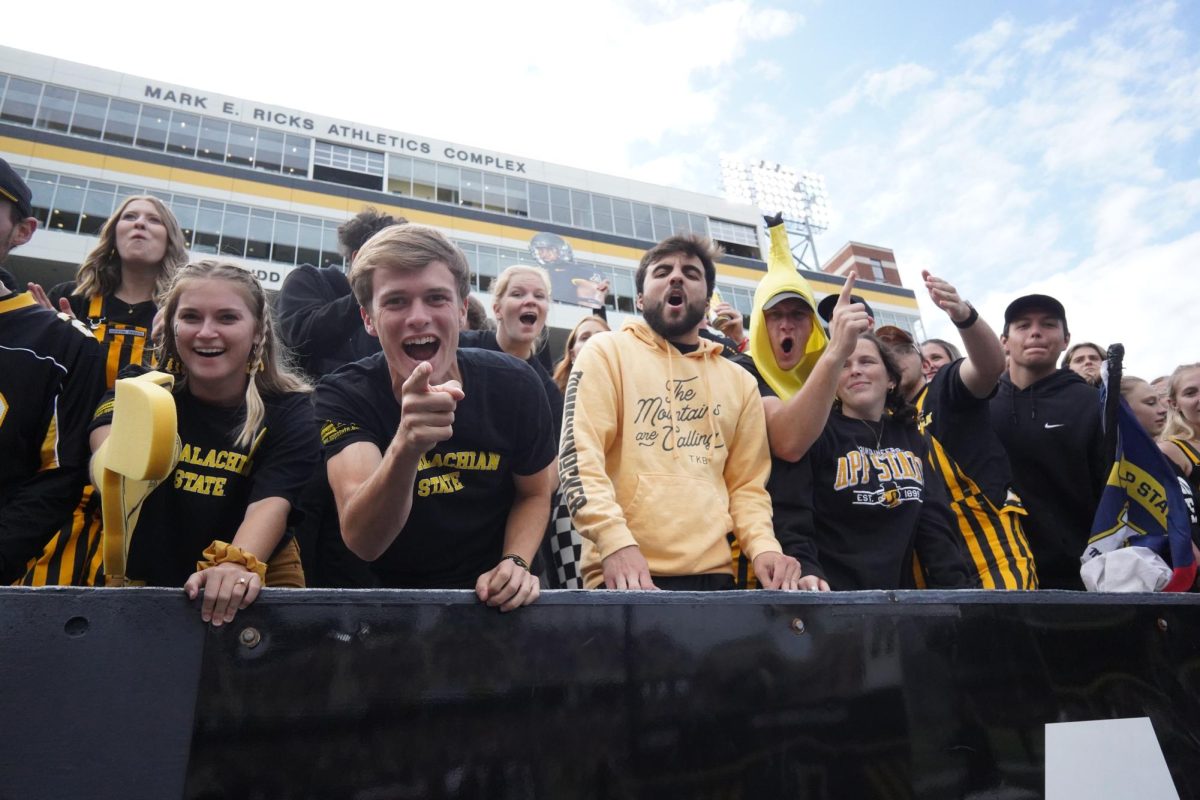 A group of fans cheering on the Mountaineers against James Madison Sept. 24, 2022.