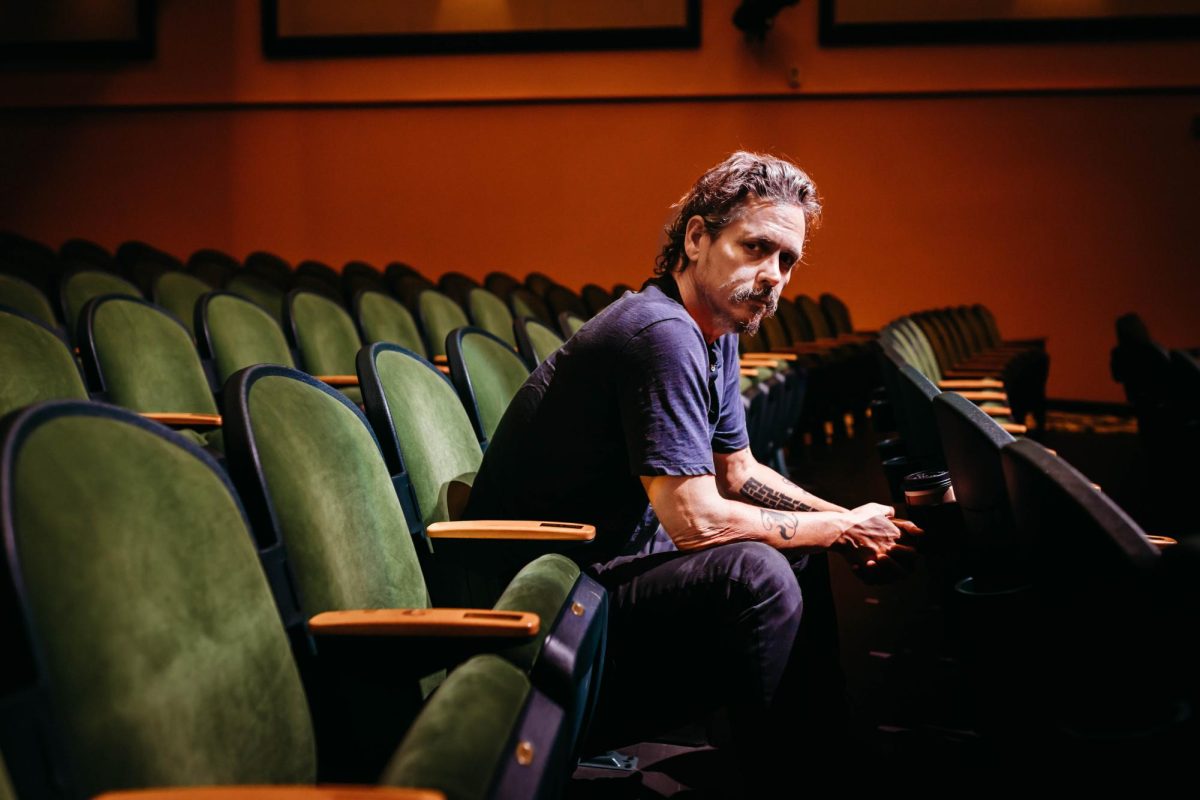 John Paul White, 51, sits within the Appalachian Theatre anticipating his performance later that night on September 5th, 2023. He is a folk country artist and a prior grammy award winner that performed for the music festival Antlers and Acorns.