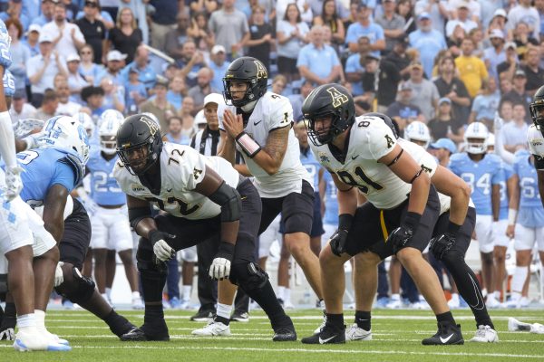Junior quarterback Joey Aguilar prepares to take the snap against No. 17 North Carolina Sept. 9. Aguilar made his first start for the Mountaineers against the Tar Heels.
